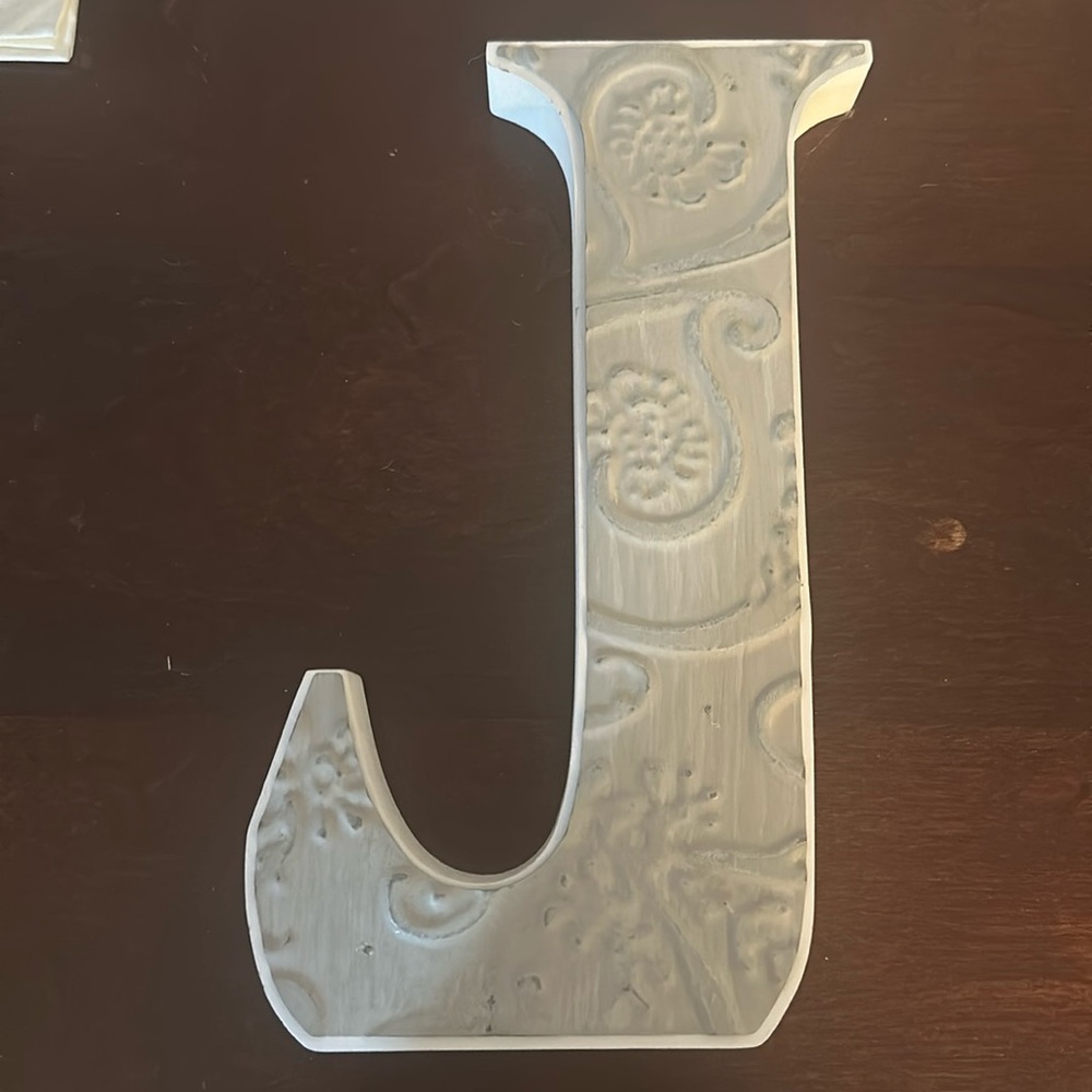 wooden “J” sign with metal florals